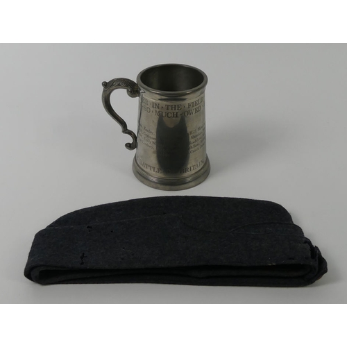 240 - An RAF WWII side cap with badges together with a pewter Battle of Britain tankard, 13cm.