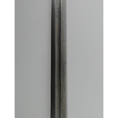 249 - An Arabic bayonet in scabbard with white metal fittings, blade 42cm.