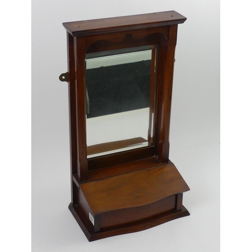 297 - An Edwardian walnut hanging mirror. 62 x 34 x 18.5cm.