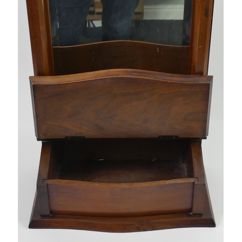 297 - An Edwardian walnut hanging mirror. 62 x 34 x 18.5cm.