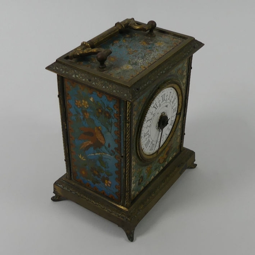 316 - Ornately decorated brass mantle clock from the 19th century, 19.5cm to top of handle.