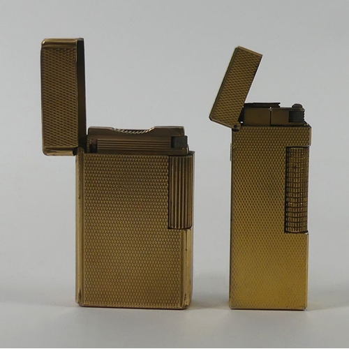 321 - Dunhill gold plated lighter along with a Dupont example.