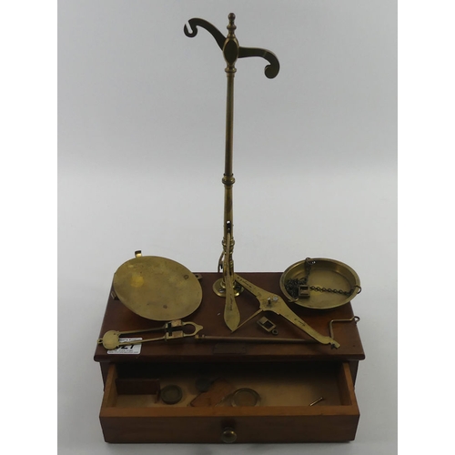 327 - A mahogany cased set of shop scales with Hunt & Co label, 31.5cm wide.