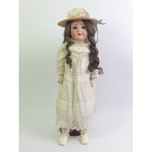 336 - A Simon and Halbig bisque head porcelain doll number 1909-4 1/2. 56cm tall.