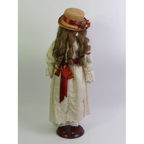 337 - An Armand Marseille bisque head doll number 390. 58cm tall.