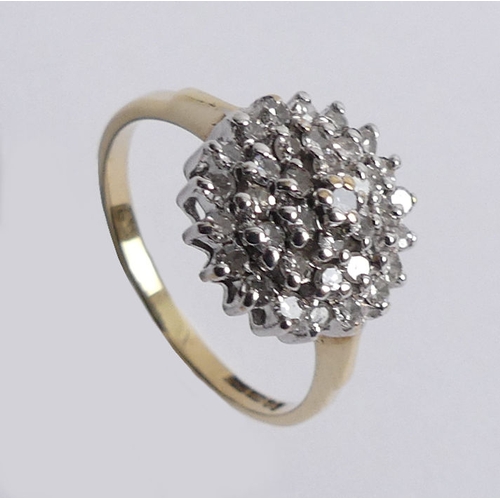 71 - 9ct gold diamond cluster ring, 2.1 grams, 11.3mm, size J.