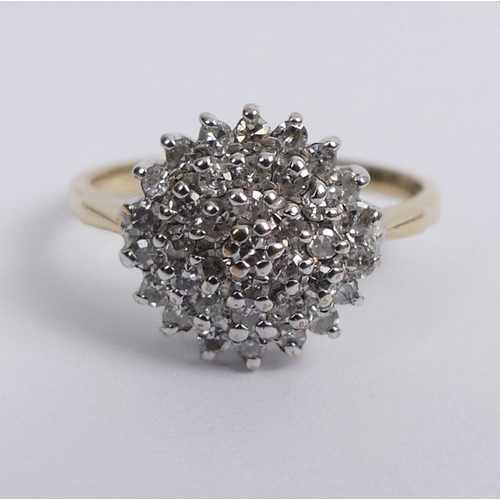 71 - 9ct gold diamond cluster ring, 2.1 grams, 11.3mm, size J.