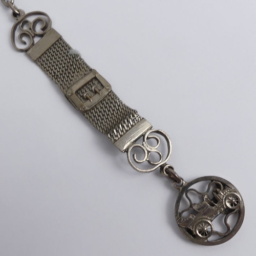 136 - Victorian silver open face pocket watch with buckle and belt design Albert chain and car fob.