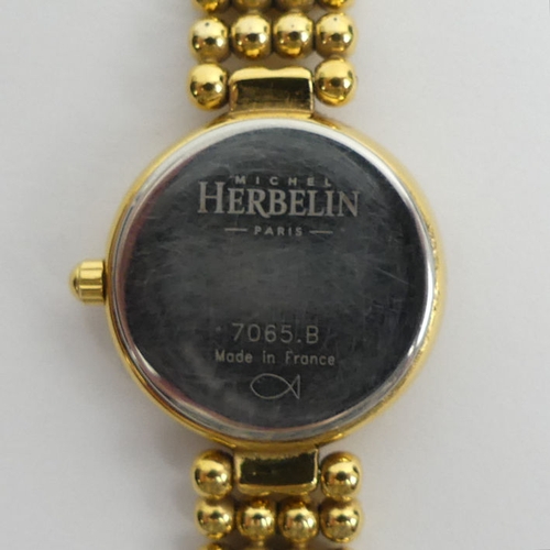 144 - Michel Herbelin gold tone ladies quartz watch, 24mm wide inc. button.
Condition report: In working o... 