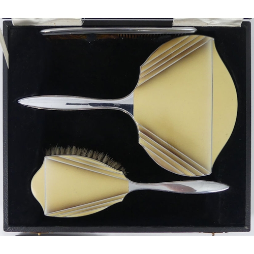 259 - A Cased silver plated brush set together with a collection of button hooks.