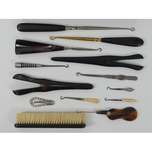 259 - A Cased silver plated brush set together with a collection of button hooks.