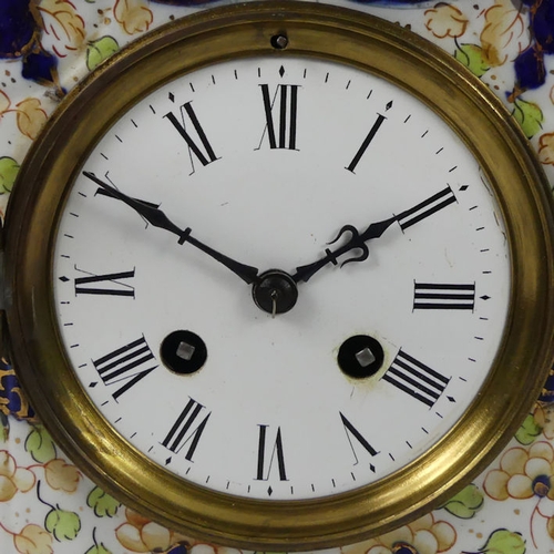 258 - A Victorian china mantel clock striking on a bell, 28cm x 23cm.