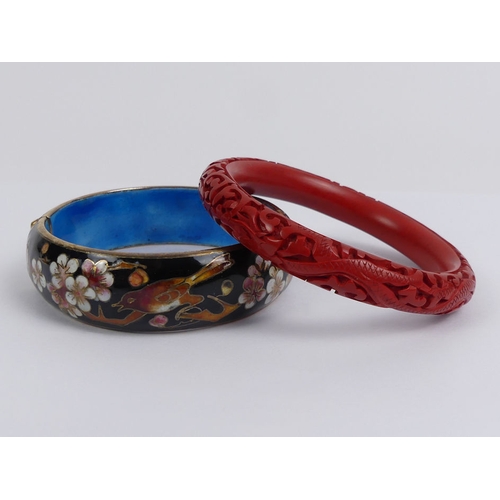 10 - A cinnabar lacquer bangle and a Chinese cloisonne hinged bangle.