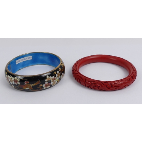 10 - A cinnabar lacquer bangle and a Chinese cloisonne hinged bangle.