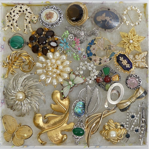 26 - A collection of brooches, including silver and enamel examples.