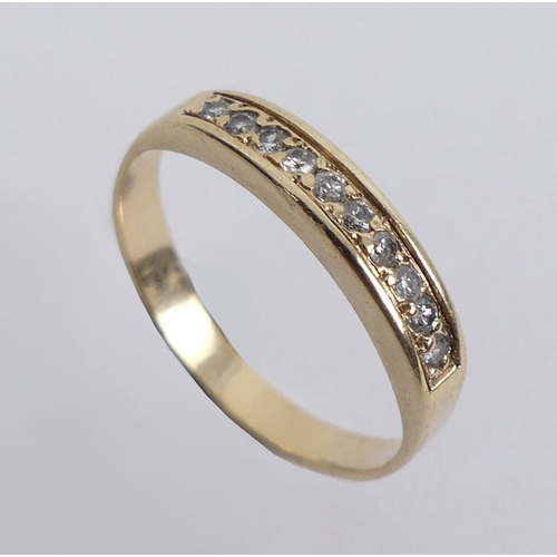 29 - 9ct gold diamond channel set ring, 1.7 grams, 3.4mm, size L 1/2.