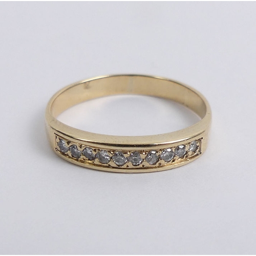 29 - 9ct gold diamond channel set ring, 1.7 grams, 3.4mm, size L 1/2.