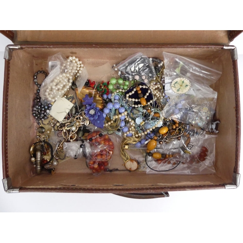 48 - A case containing various items of costume jewellery and watches, including a silver and amber neckl... 