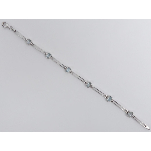 55 - 9ct white gold aquamarine set bracelet, 7.8 grams.