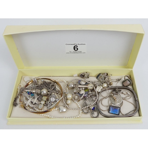 6 - A box of mostly silver costume jewellery including two bangles and a bird brooch, 135 grams gross.