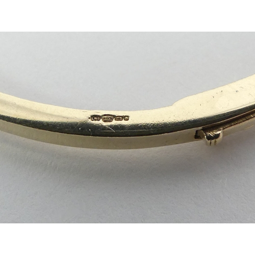 65 - 9ct gold diamond set hinged bangle, 8.1 grams, 2.6mm.