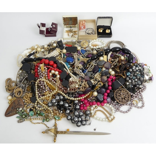 67 - A large box of mixed costume jewellery including some silver items.