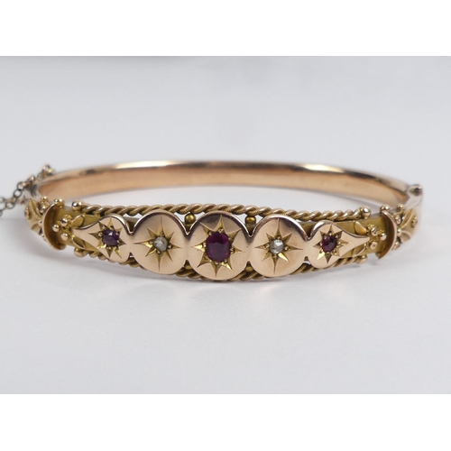 72 - Edwardian 9ct rose gold, ruby and diamond hinged bangle, Birm. 1905, 9.2 grams, 10.3mm.