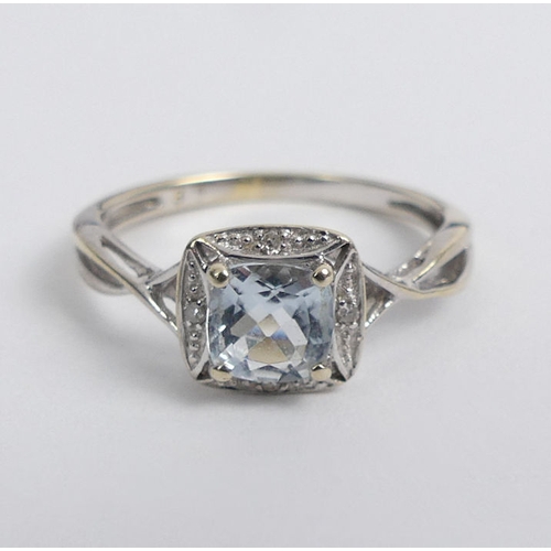 77 - 9ct gold aquamarine and diamond ring, 1.4 grams, 7.3mm, size J.