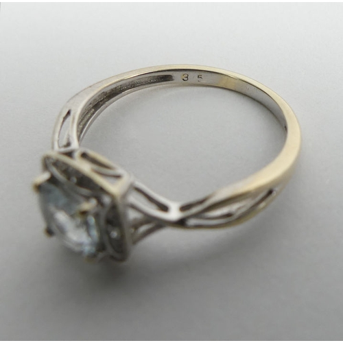 77 - 9ct gold aquamarine and diamond ring, 1.4 grams, 7.3mm, size J.