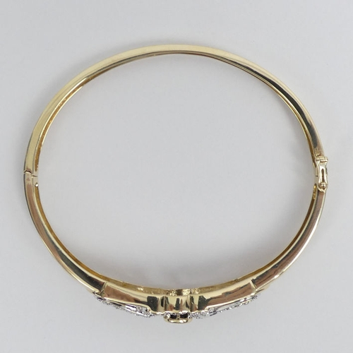 81 - 9ct gold, sapphire and diamond hinged bangle 14 grams, 12mm.