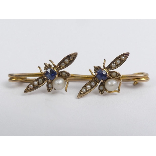 84 - 9ct gold sapphire and seed pearl bug brooch, 1.5 grams 32mm x 10mm.