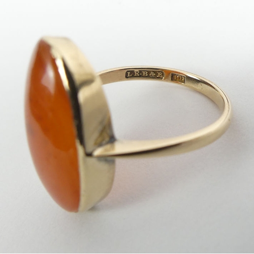 85 - 9ct gold carnelian ring, 3.7 grams, 20.8mm, size O 1/2.