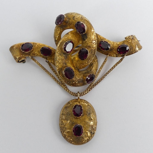 86 - Victorian 9ct gold (tested) garnet set brooch with a locket back, 14.9 grams, 66mm x 66mm.