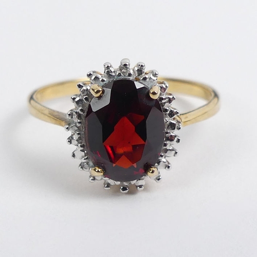 88 - 9ct gold garnet and diamond ring, 2.1 grams, 11.9mm, size P.