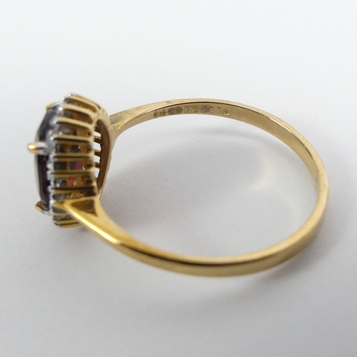 88 - 9ct gold garnet and diamond ring, 2.1 grams, 11.9mm, size P.