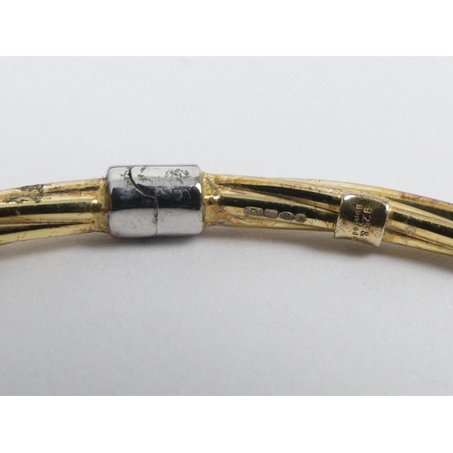 89 - 9ct gold on silver twisted torque bangle, 4.3 grams, 6mm.