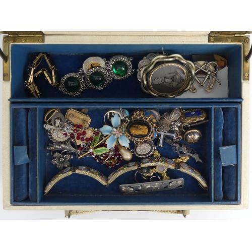 90 - A box of mixed costume jewellery including silver items, a cameo brooch and enamelled items.