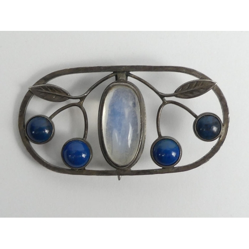 91 - Arts & Crafts silver moonstone and lapis brooch, 9.3 grams, 48mm x 25mm.