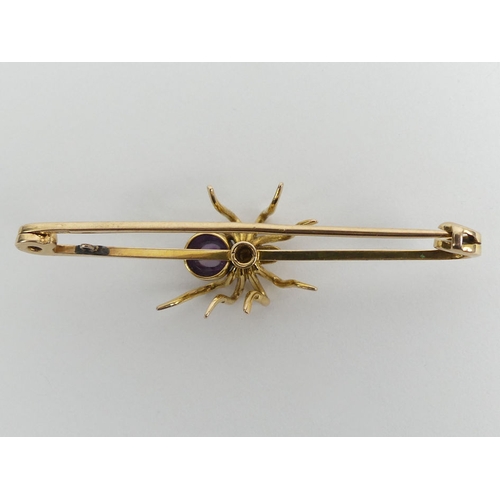 99 - 15ct gold amethyst and seed pearl spider brooch, 7.2 grams, 63mm x 18mm.