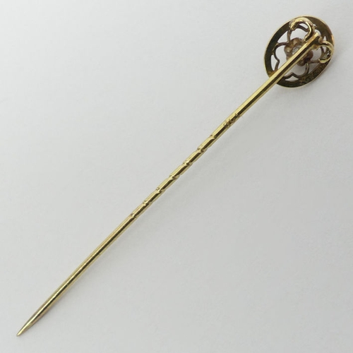 104 - 9ct gold and diamond stick pin, 59mm x 7.8mm.