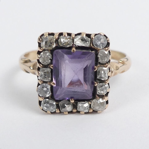 105 - 14/15ct gold (tested) purple sapphire and diamond ring, 2.6 grams.