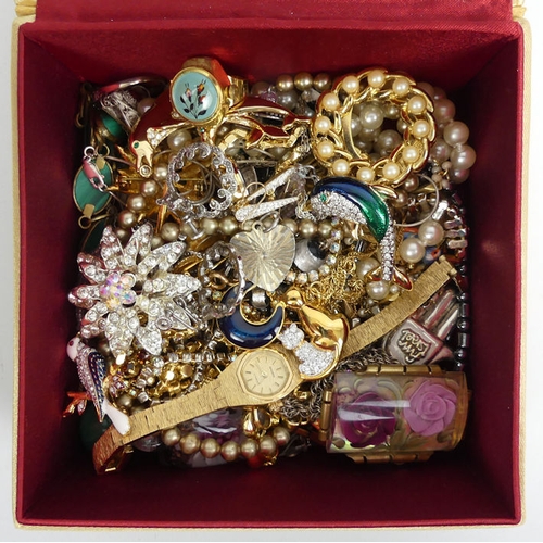 108 - A box of costume jewellery including silver items, enamel brooches and a ring watch