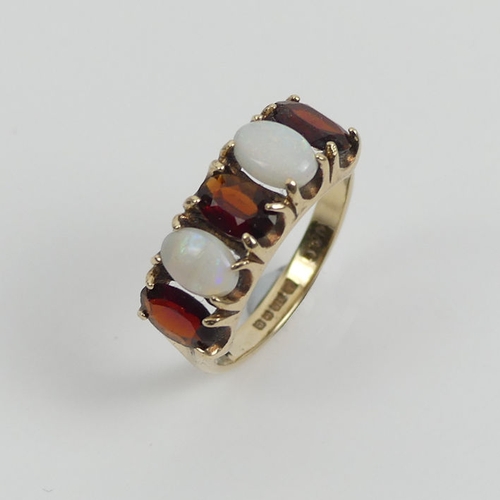 119 - 9ct gold garnet and opal five stone ring, 2.5 grams, 7mm, size L.