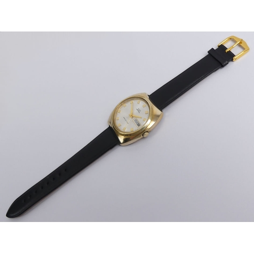 129 - Astral gold tone day date, manual wind, jewelled lever movement gents watch, 38mm wide.