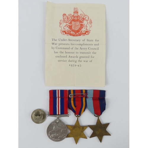 208 - A medal group, 1939 - 45 stars, Burma star and war medal 39-45, together with a service badge and pa... 