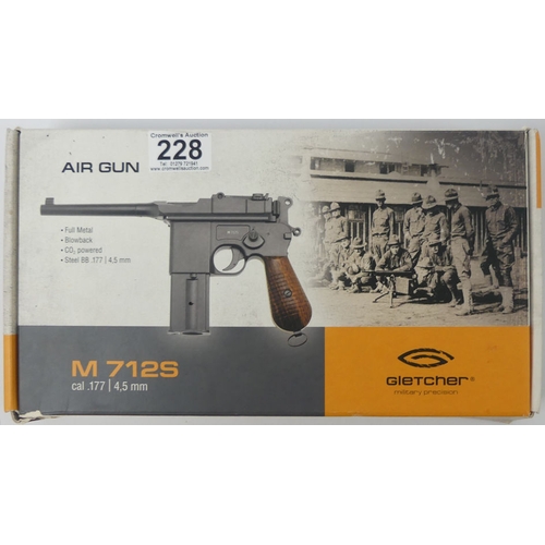 228 - Gletcher M7125 CO2 air gun, Cal. 177 boxed with instructions, 29cm. No licence is required to purcha... 