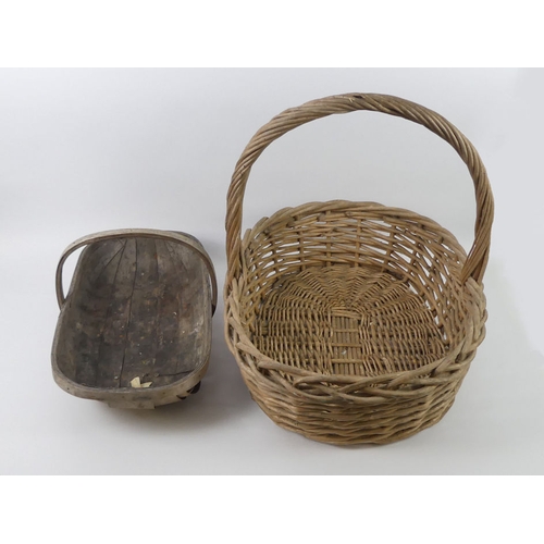 250 - Two fruit baskets including a large wicker example, 71cm x 54cm.