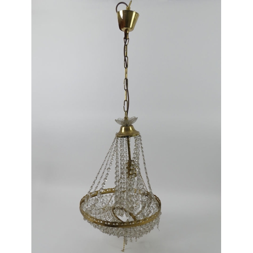 264 - Two brass and cut glass chandeliers, one boxed, 60cm.