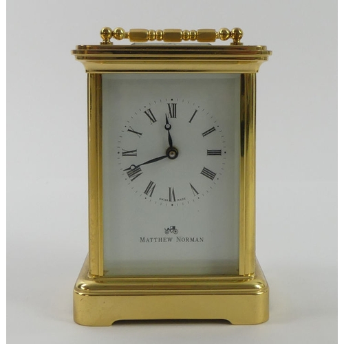 287 - A Matthew Norman brass carriage clock, 11cm x 7cm.