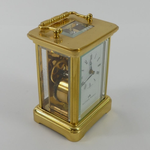 287 - A Matthew Norman brass carriage clock, 11cm x 7cm.